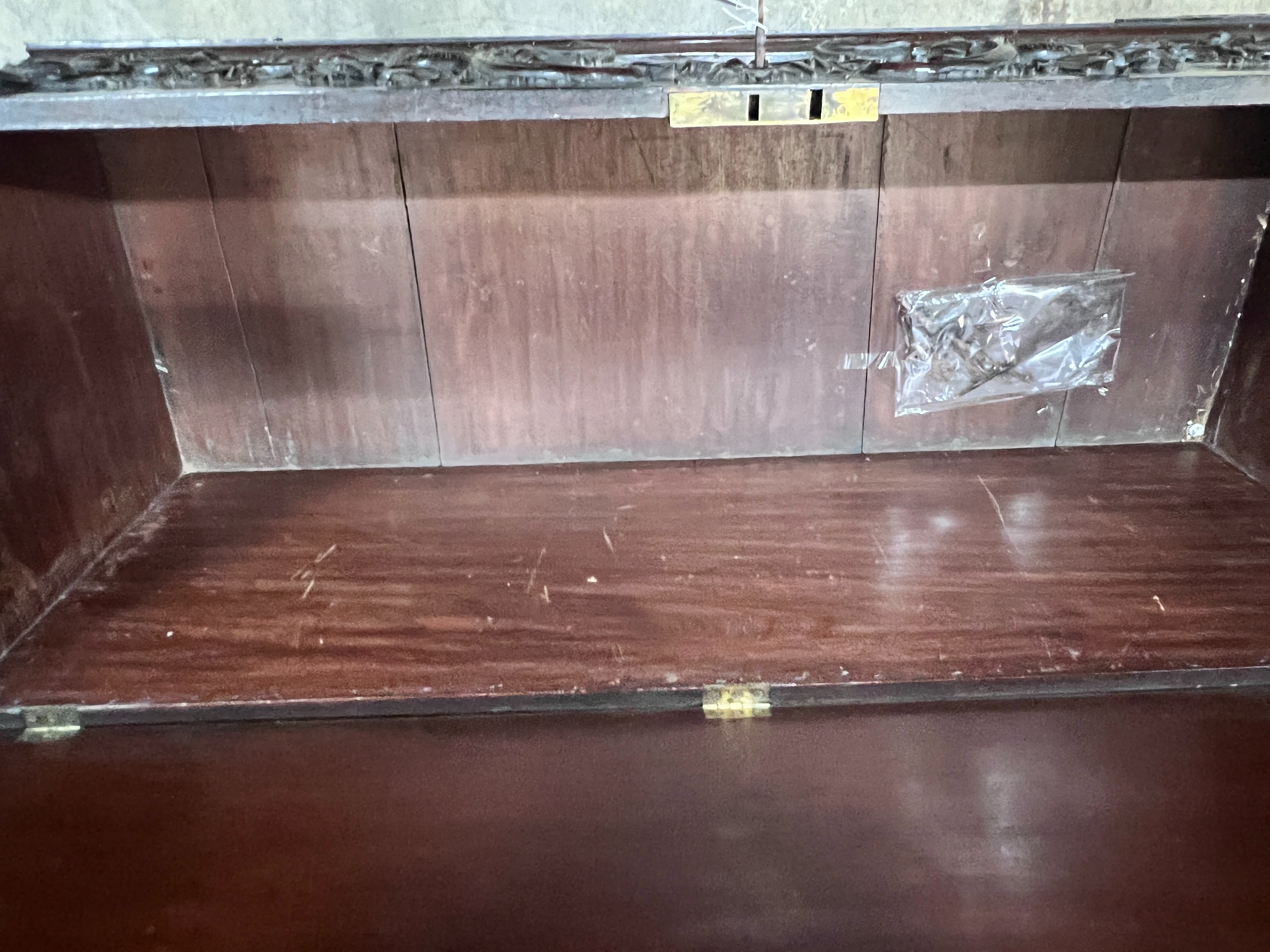 An 18th century style walnut coffer with carved applied front, width 140cm, depth 53cm, height 49cm